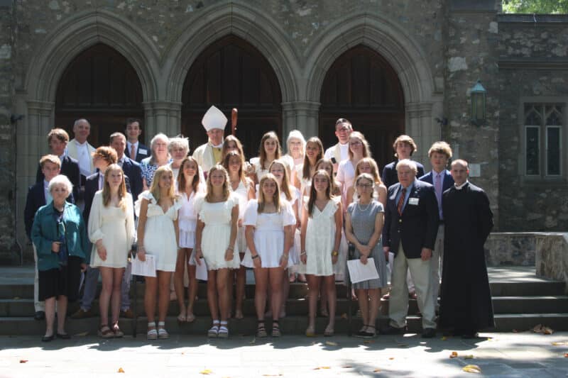 Group of confirmands posing outside at St. Stephen's Church in Richmond, Virginia