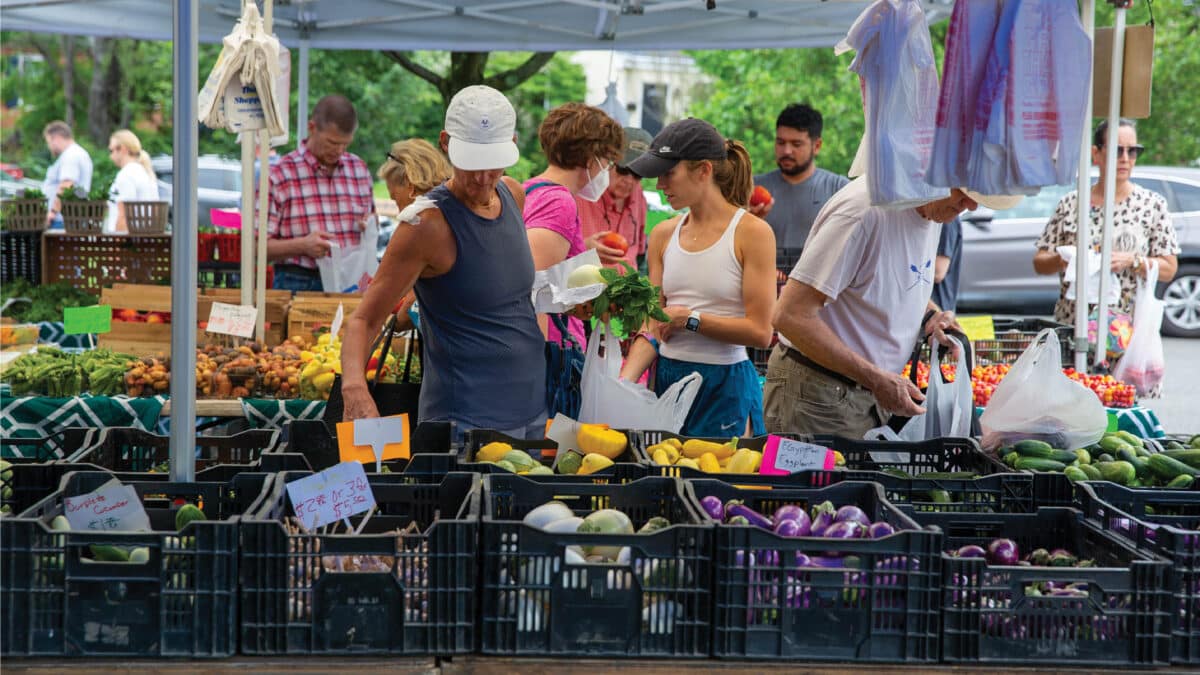 People shopping at farmers market at St. Stephen's Church in Richmond, Virginia