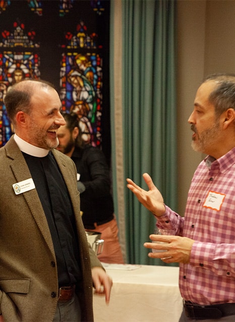 Pastor and new church member conversing at St. Stephen's Church in Richmond, Virginia